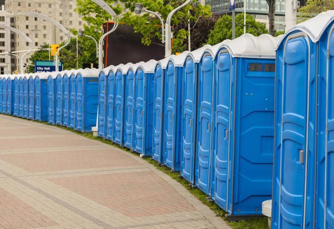 a row of portable restrooms set up for a large athletic event, allowing participants and spectators to easily take care of their needs in Capistrano Beach, CA